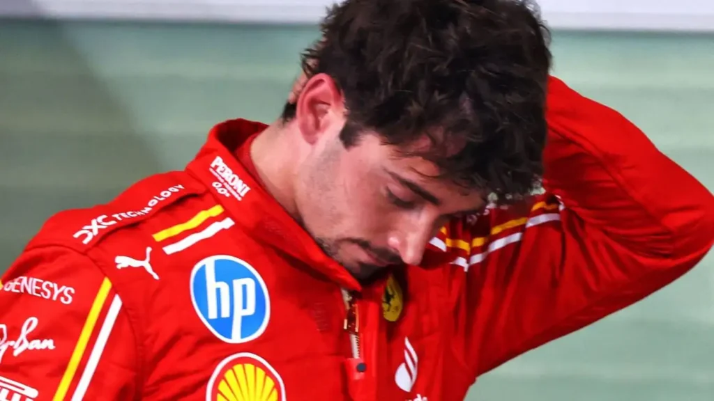 charles leclerc ferrari driver looking downcast