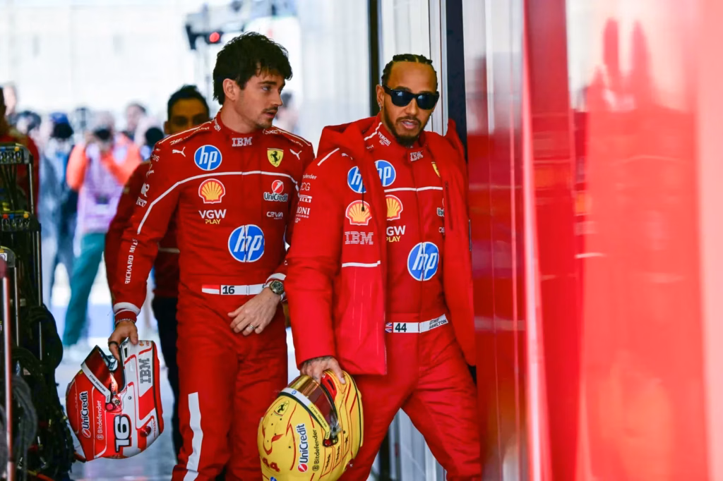 lewis hamilton and charles leclerc in ferrari team kit.