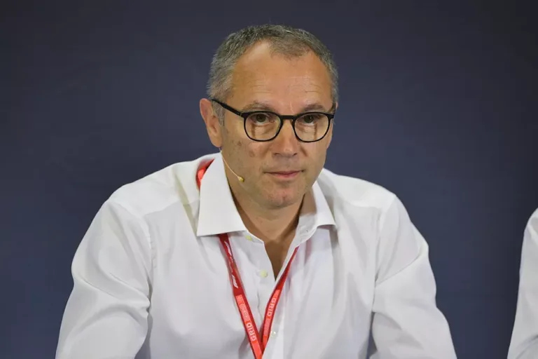 stefano domenicali as part of a panel